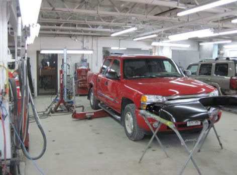 Red pickup truck in the shop